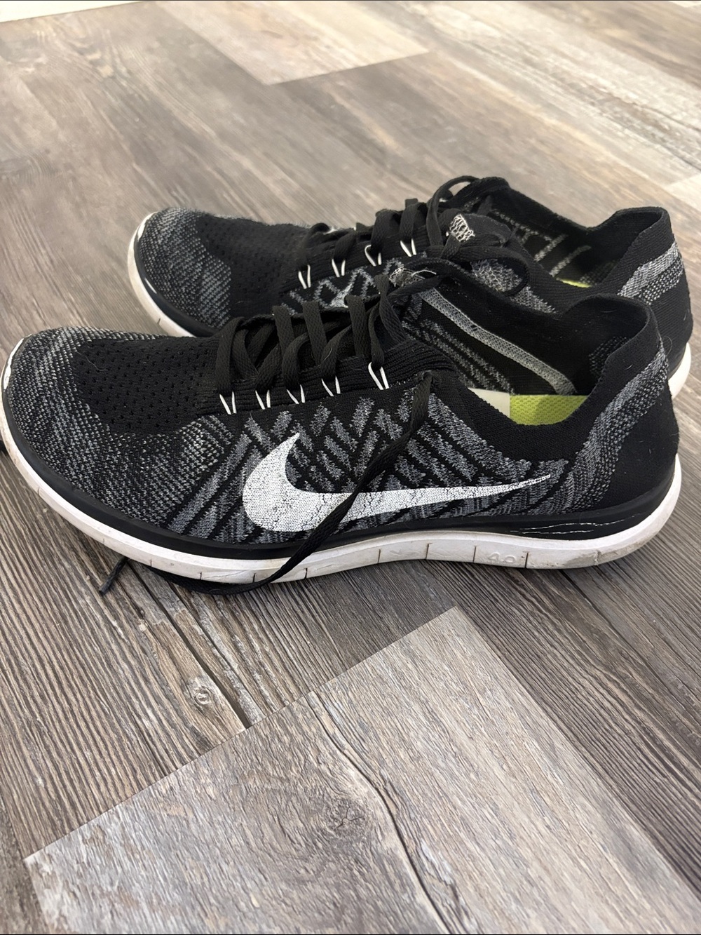 Nike Men’s Black and White Flyknit Athletic Sneakers